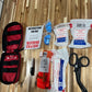 Portable bleeding control kit with tourniquet, bandages, and trauma supplies for schools and workplaces
