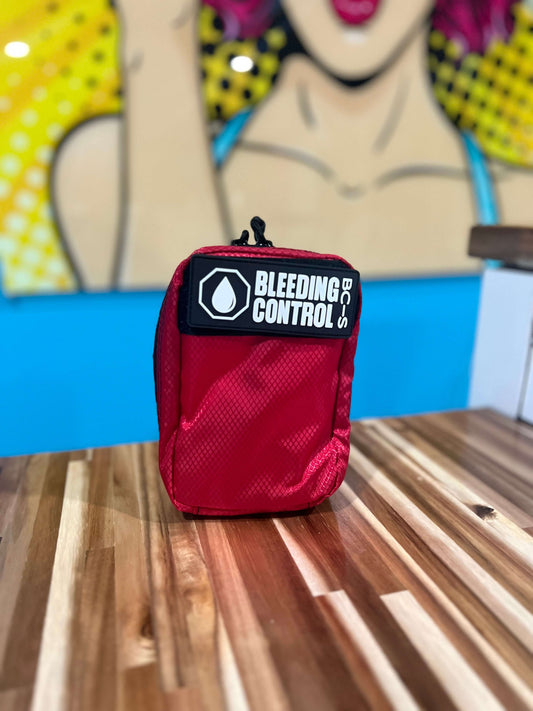 Portable bleeding control kit with tourniquet, bandages, and trauma supplies for schools and workplaces